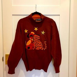 Escada sweater with tiger dog appliqué.